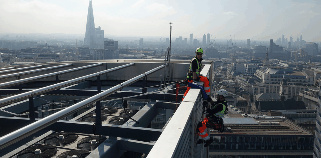 working at height specialists conducting a facade condition survey of Moor House, London