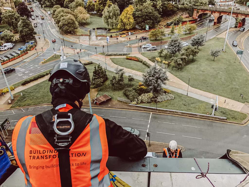 team of two conducting a facade condition survey via rope access