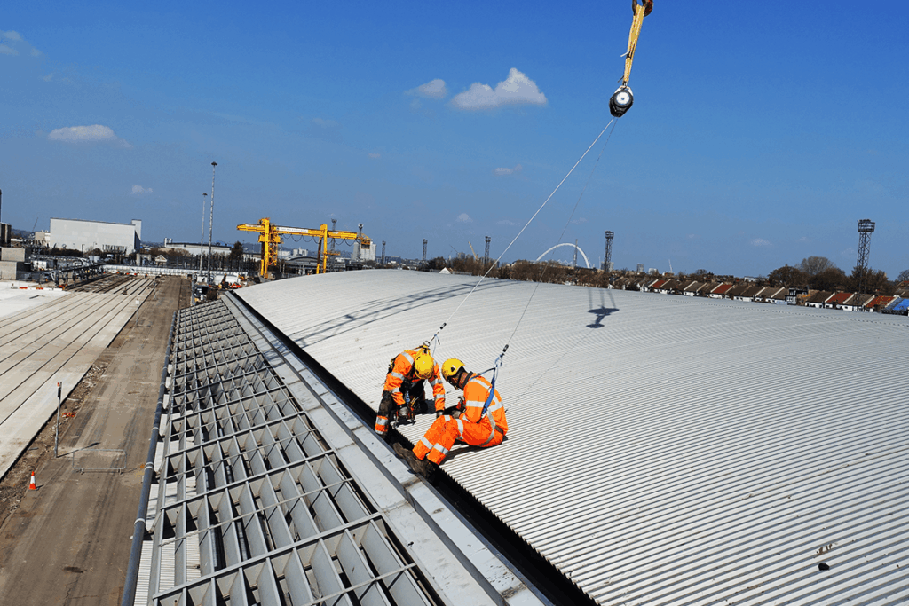 Gutter cleaning using rope access on a curved steel roof